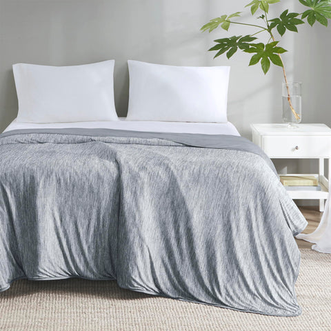 Degrees of Comfort grey throw on patio demonstrating versatile outdoor use
