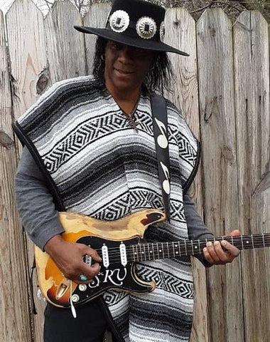 Del Mex poncho with measuring tape showing dimensions and fit benefit for buyers