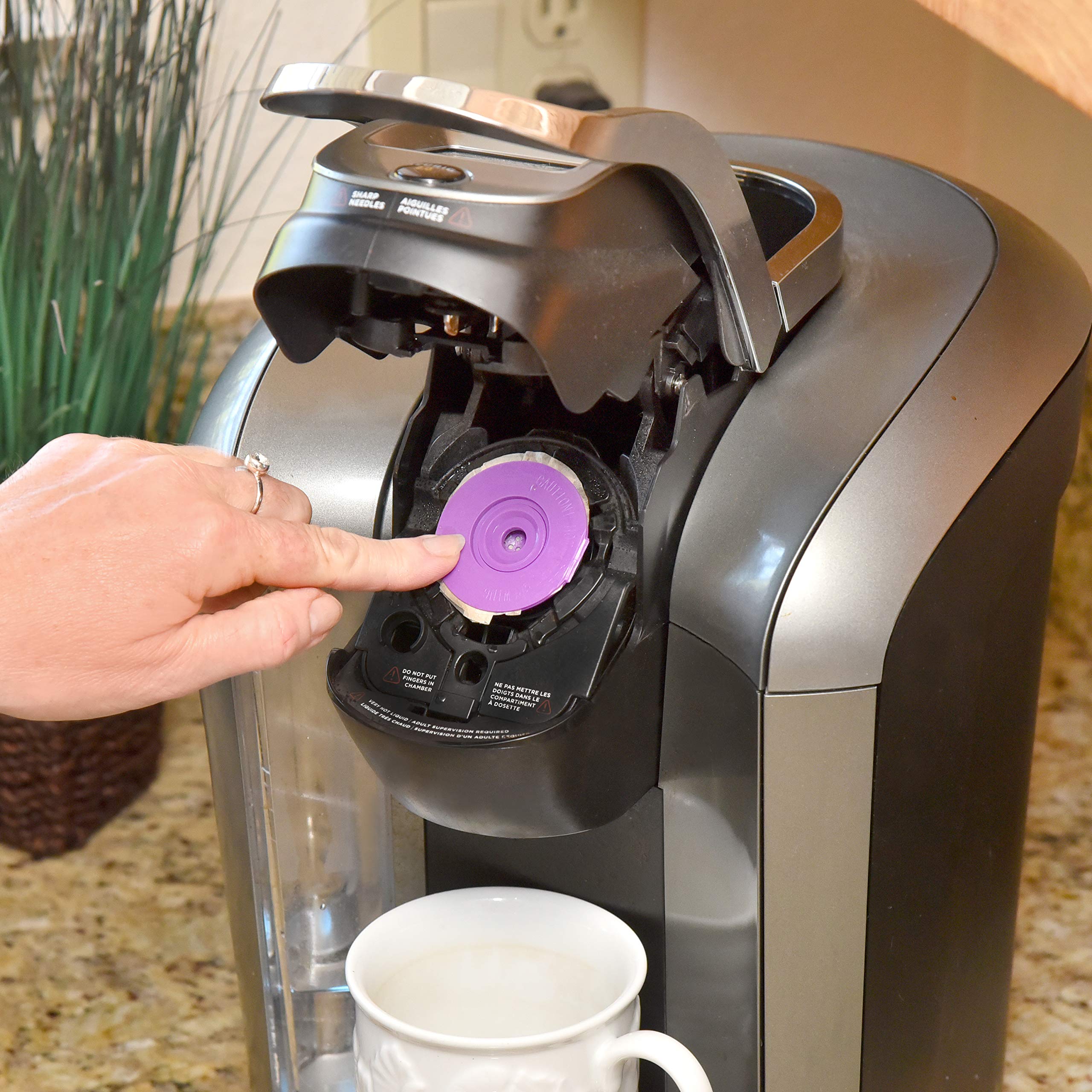 Delibru lid snapped onto pod ready to brew and prevent spills