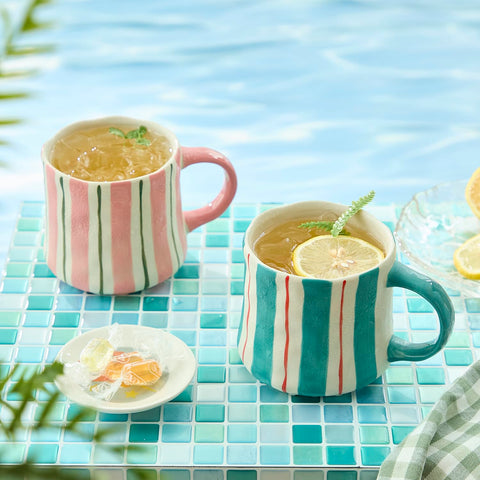 DELIGHTS GALORE mug in use with coffee pour showing heat retention benefit