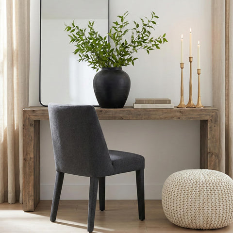 Denique candlesticks next to a fork to show scale, helping buyers visualize size for table settings
