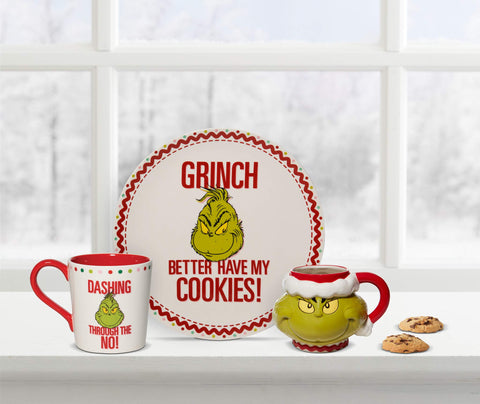Department 56 Grinch mug in use on holiday table demonstrating large 32oz serving and charm