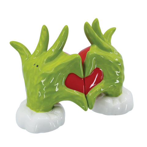 Department 56 Grinch next to utensils for scale demonstrating compact tabletop size