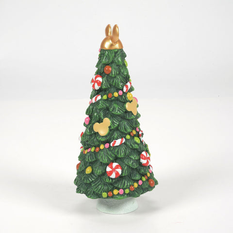 Department 56 candy tree next to a lit house showing relative 6.5-inch scale compatibility