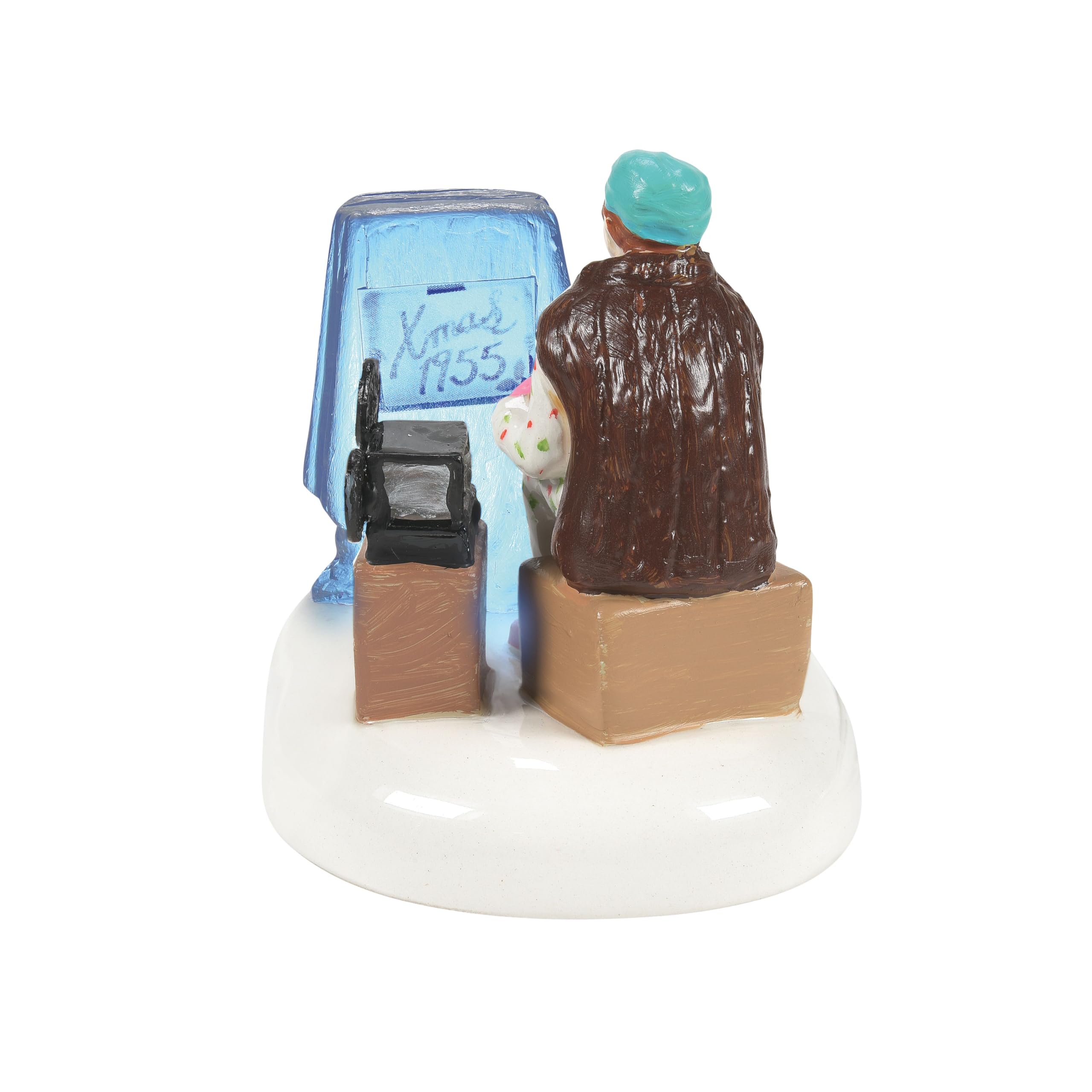 Department 56 size comparison beside Snow Village house demonstrating compatible scale
