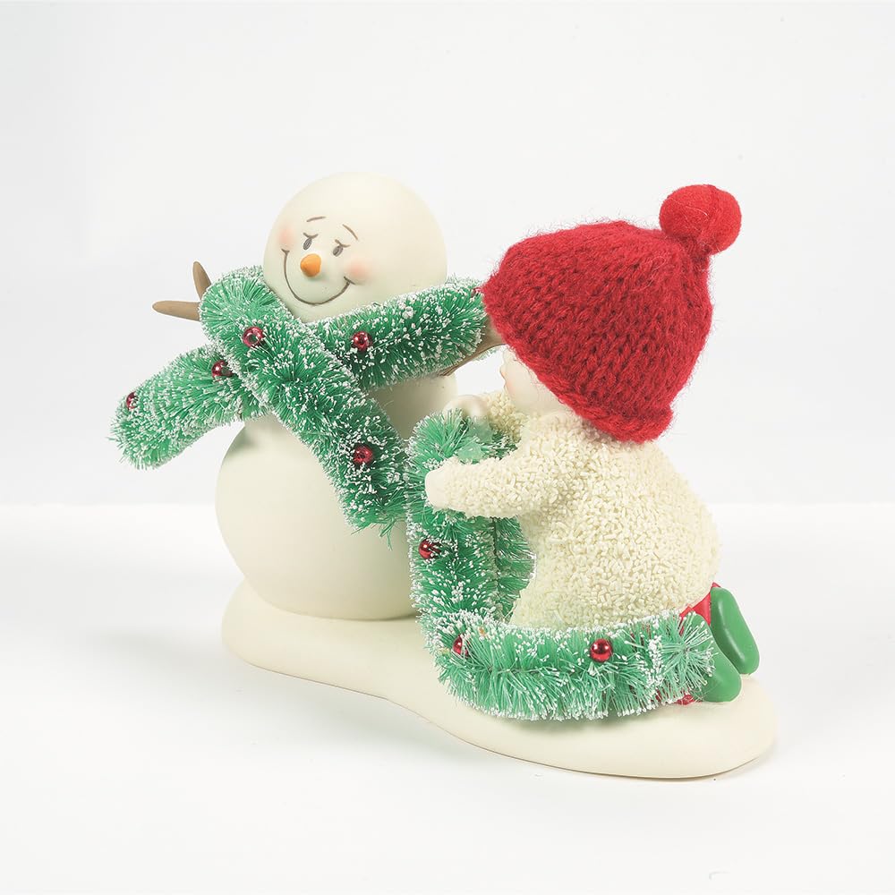 Department 56 Snowbabies scale comparison beside a coin showing compact size