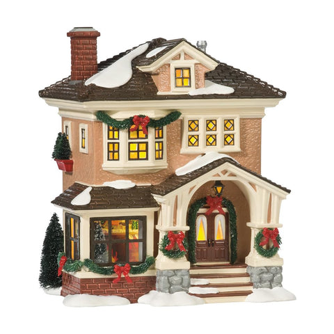 Department 56 front view showing lit house and inviting holiday appeal
