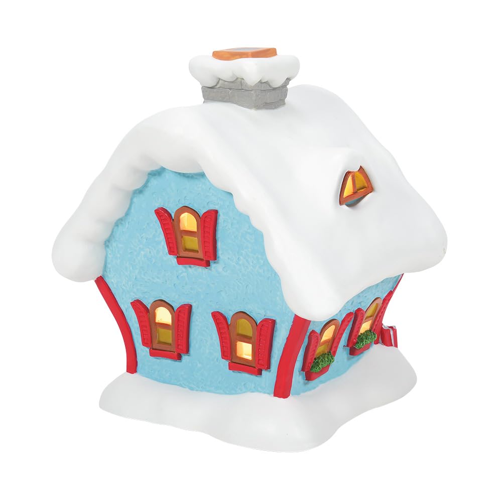 Department 56 lit building glowing warmly to enhance evening village ambiance