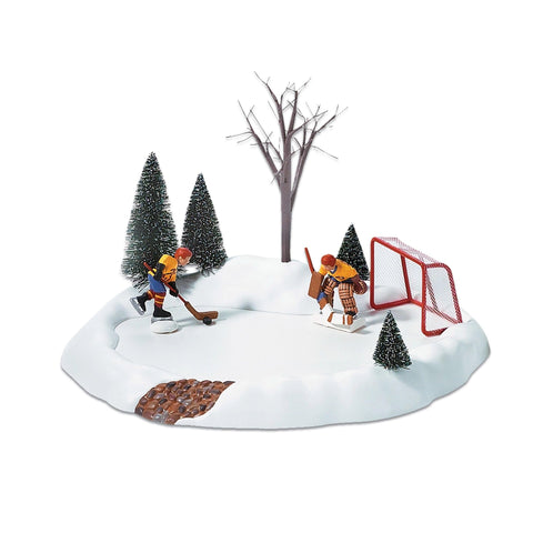 Department 56 front view showing animated hockey rink and festive trees