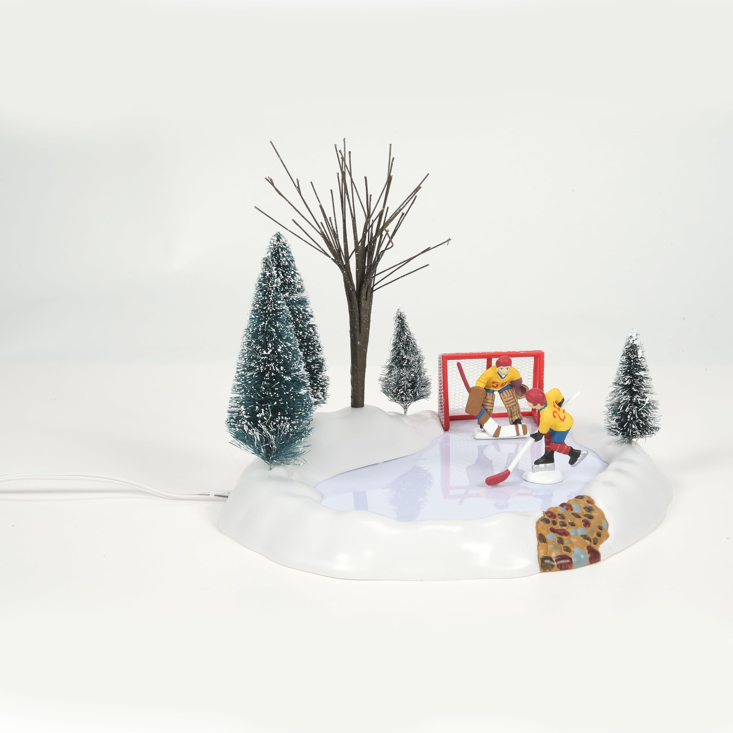 Department 56 rink integrated into village display adding lively motion