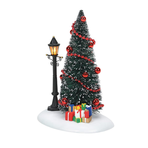 Department 56 lit vignette front view showing tree, lamp, and gifts for festive charm