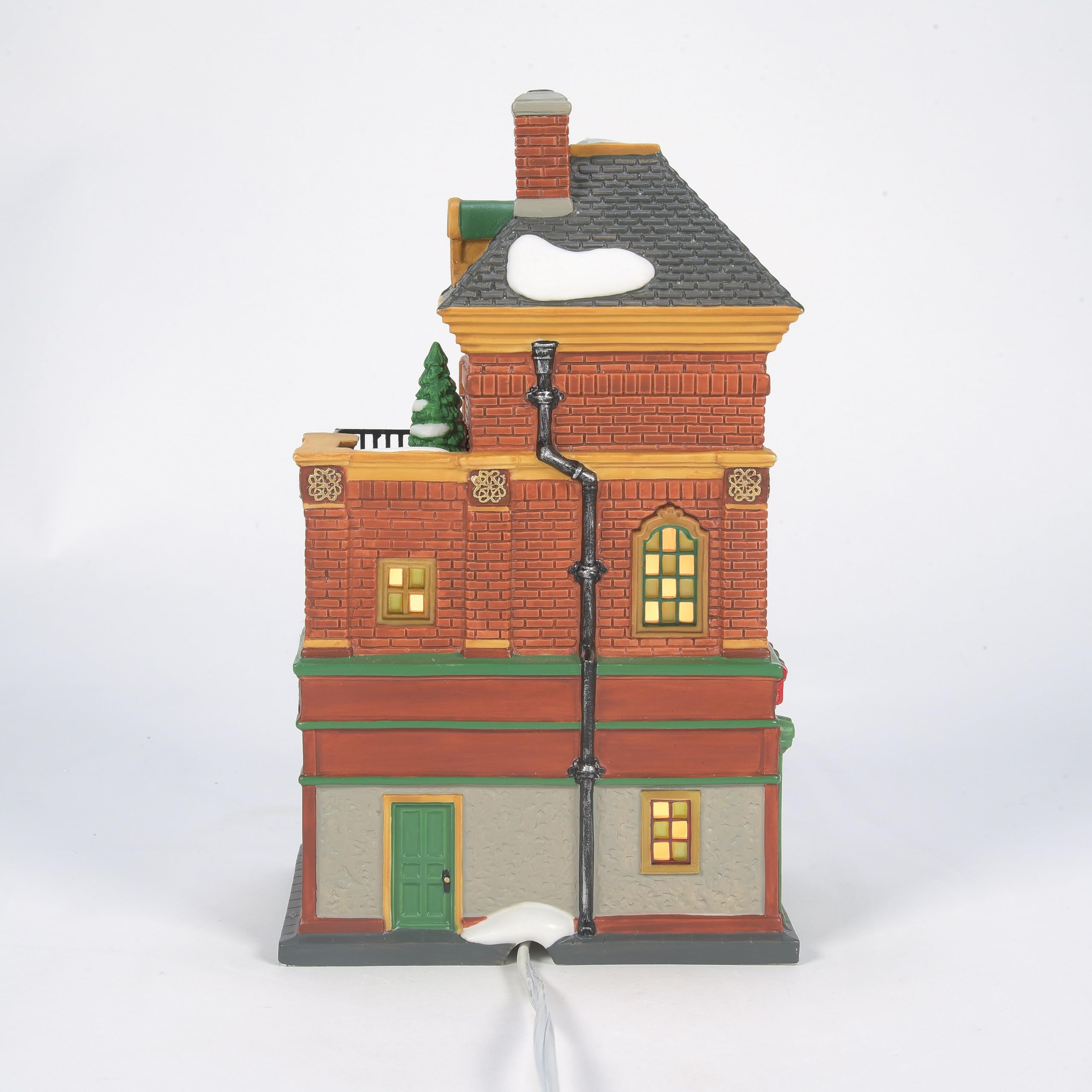 Department 56 Murphy's pub on mantel with trees and figures showcasing display impact