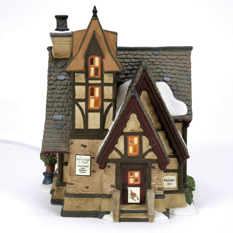 Department 56 side detail capturing painted signage and architectural ornamentation