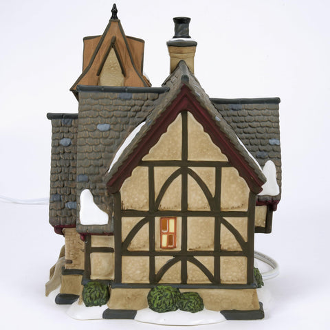 Department 56 lit windows glowing warmly to enhance evening village ambiance