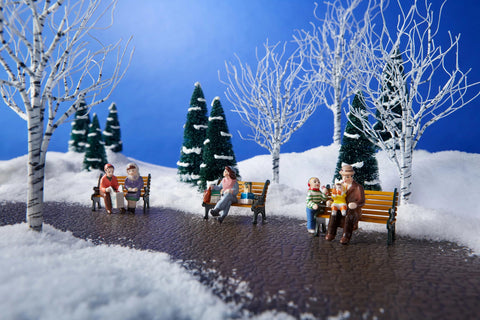 Department 56 figurine set arranged as a gift display ideal for seasonal decorating