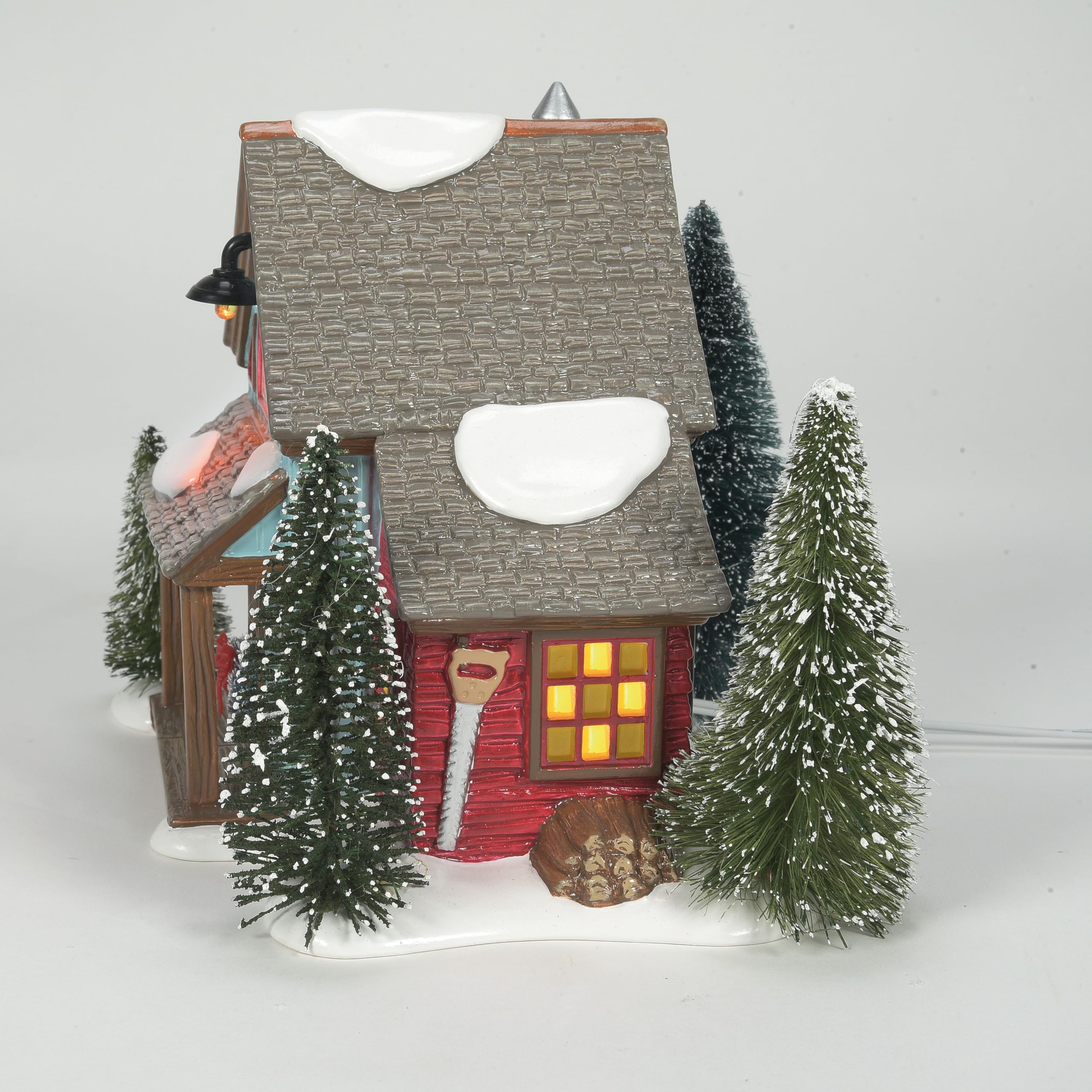 Department 56 tree lot beside figurine for scale and display coordination