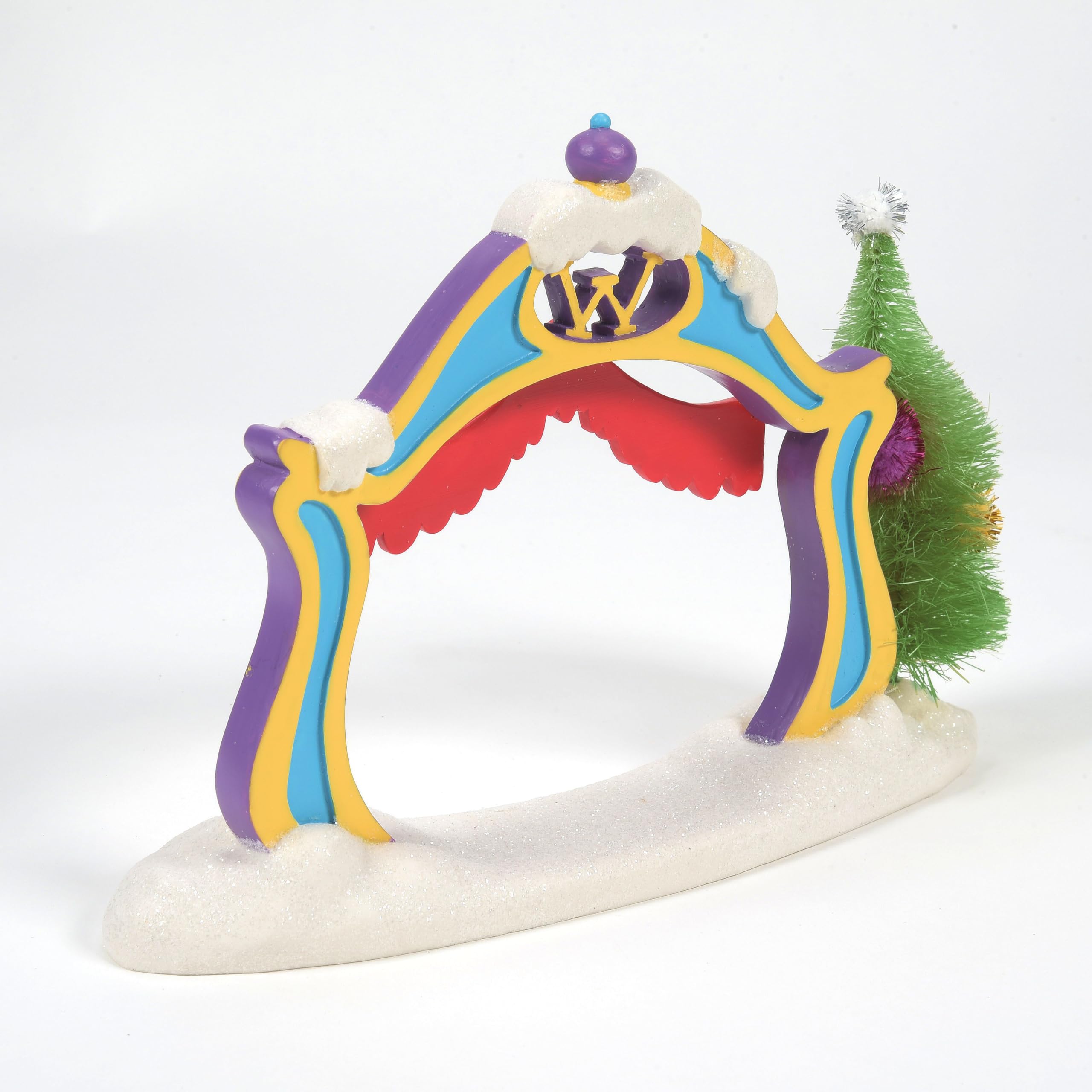 Department 56 Who-ville archway placed among lit village buildings for dramatic effect