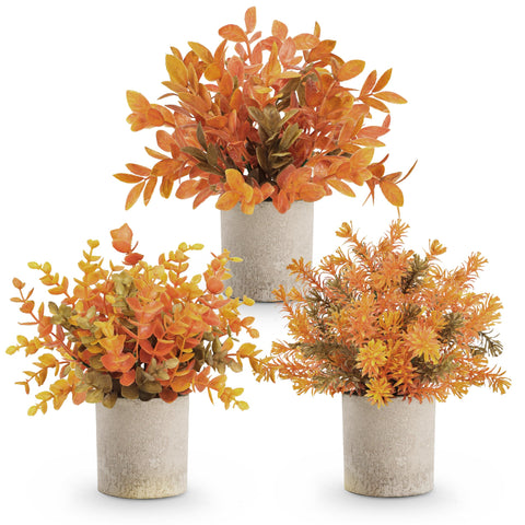 Der Rose front view of three warm orange faux plants showing autumn accent