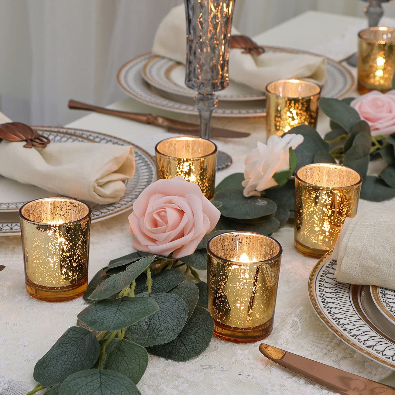 DEVI votive holders used in wedding centerpiece creating warm ambient light
