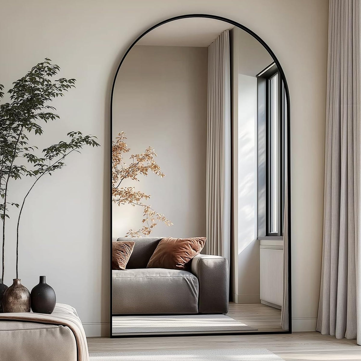 Dewfig arched full-length mirror front view showing elegant silhouette and room brightening
