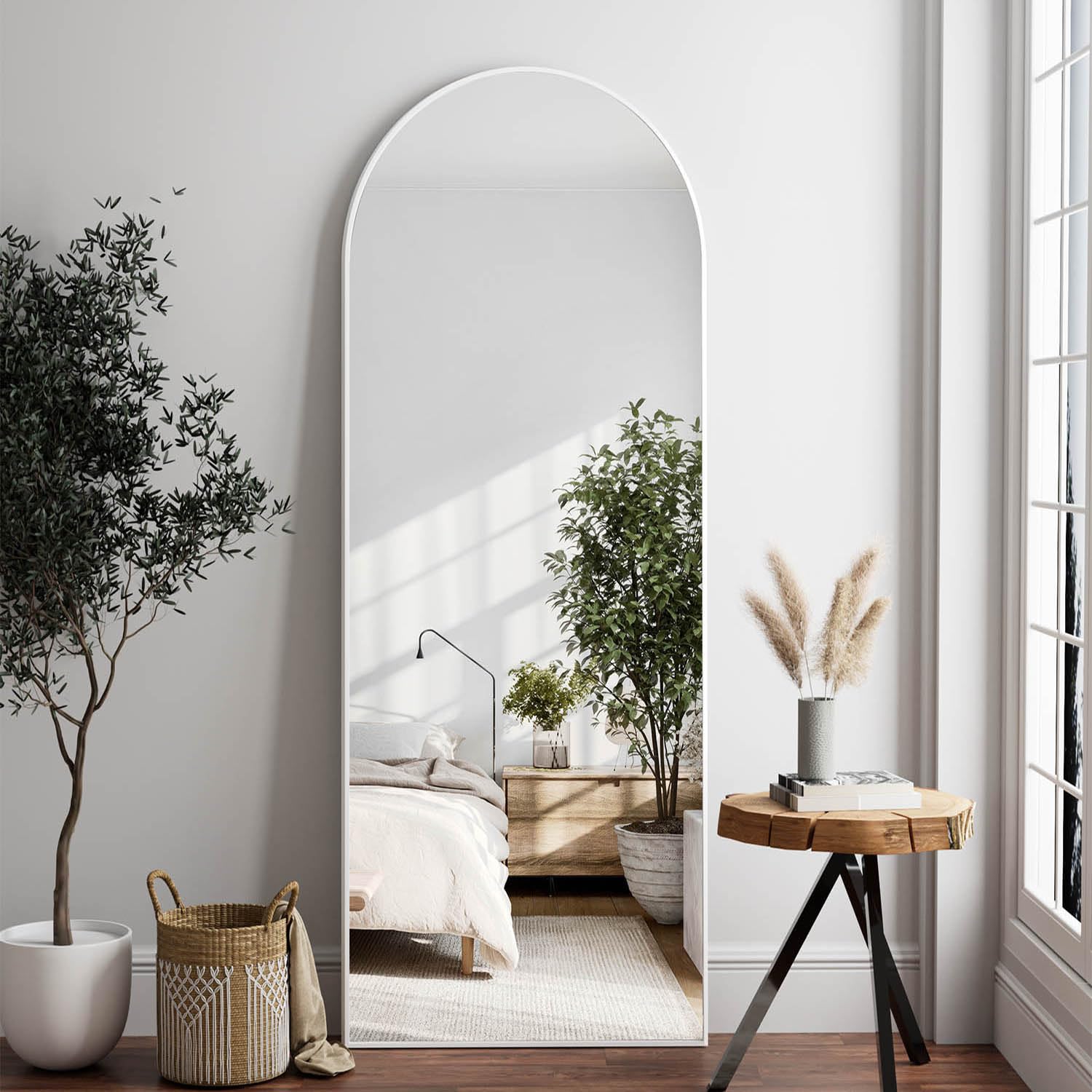 Dewfig front view of arched full-length mirror brightens room