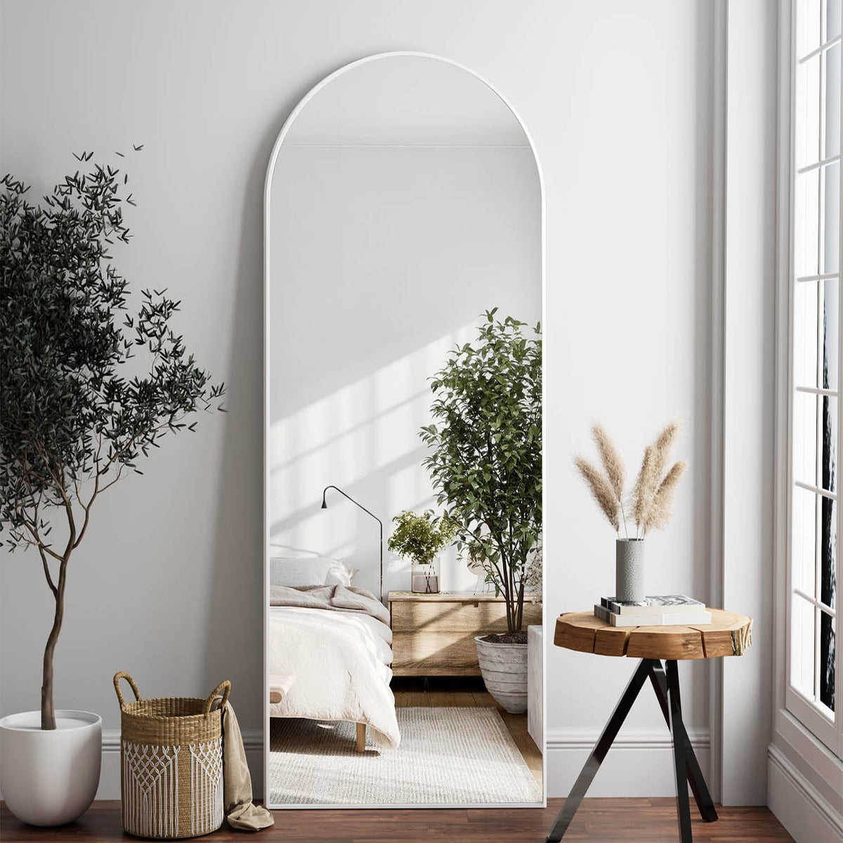 Dewfig front view of arched full-length mirror brightens room