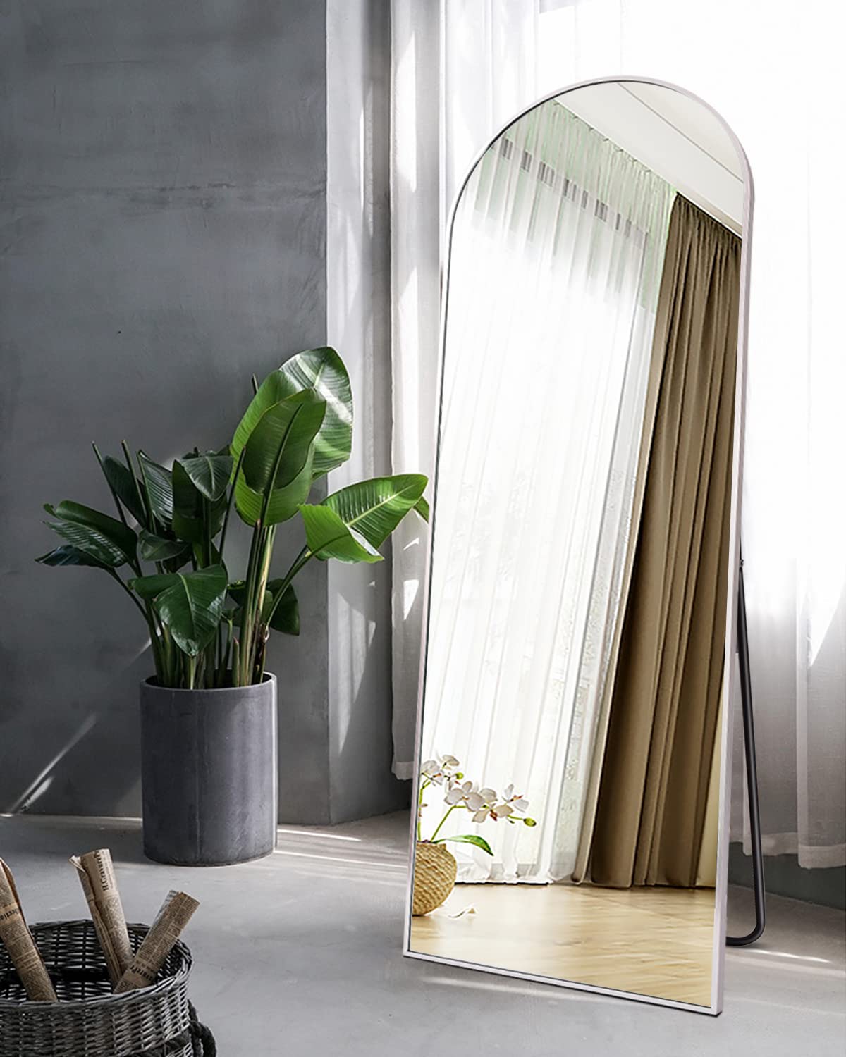Dewfig mirror in bedroom lifestyle scene adds depth and light