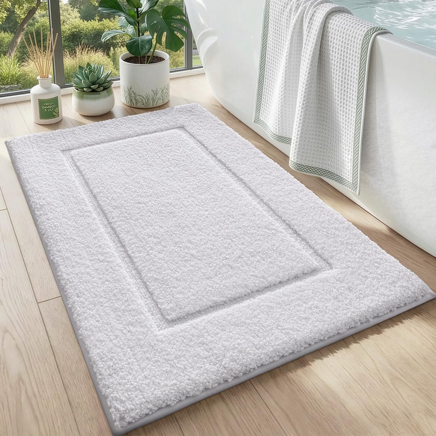 DEXI bath mat front view showing plush white pile and neat edges for comfort