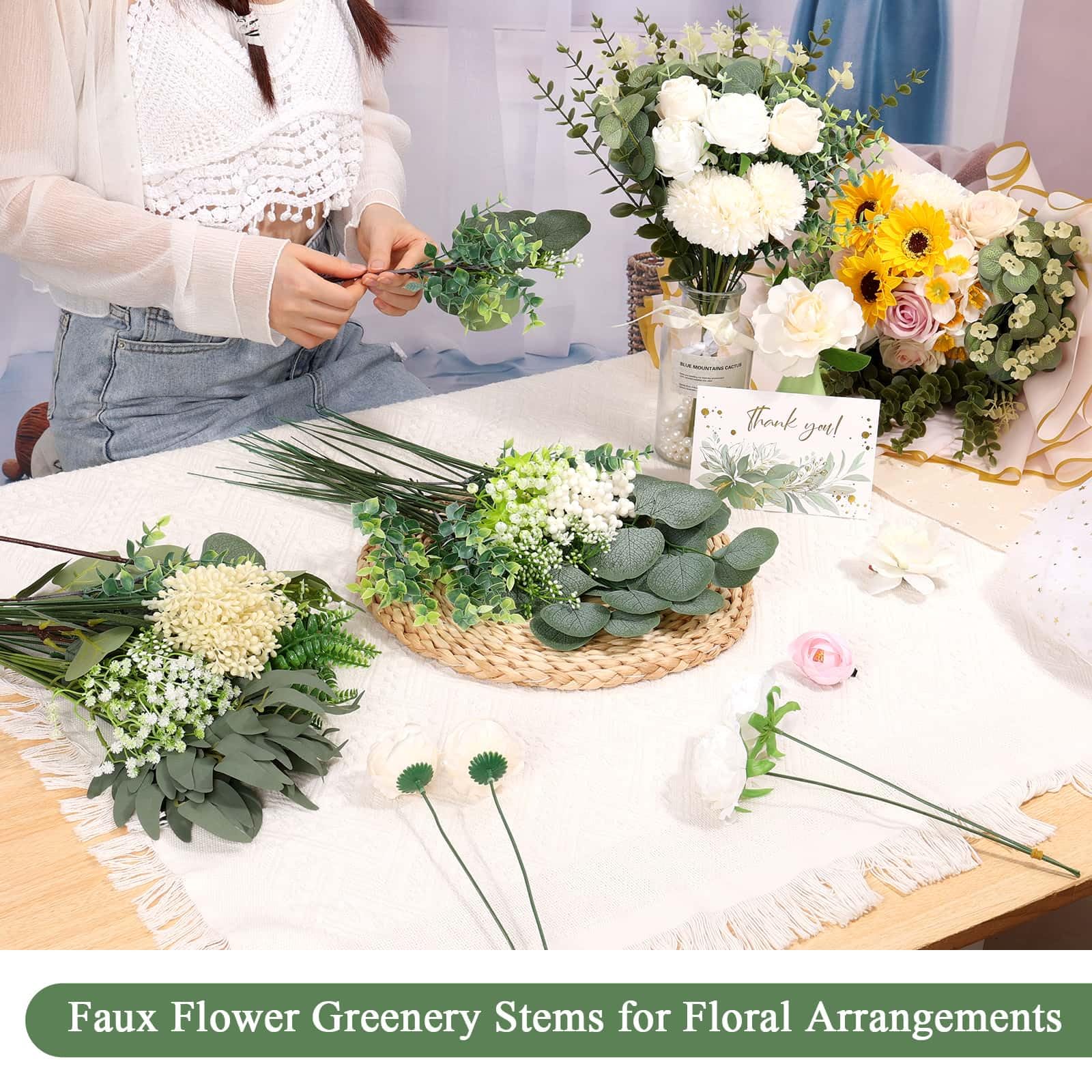 Dexpinzo wedding centerpiece using assorted eucalyptus for a cohesive event look
