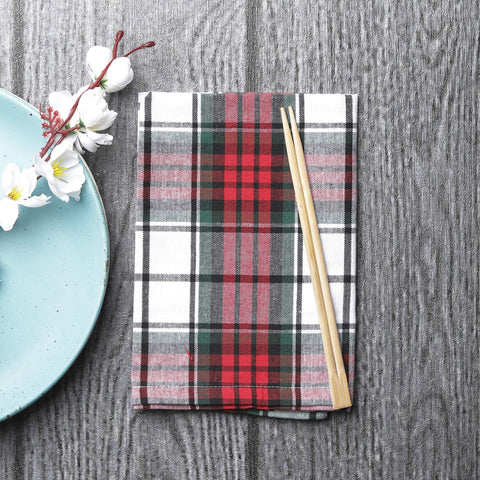 DG Collections folded napkin beside plate illustrating elegant place-setting styling