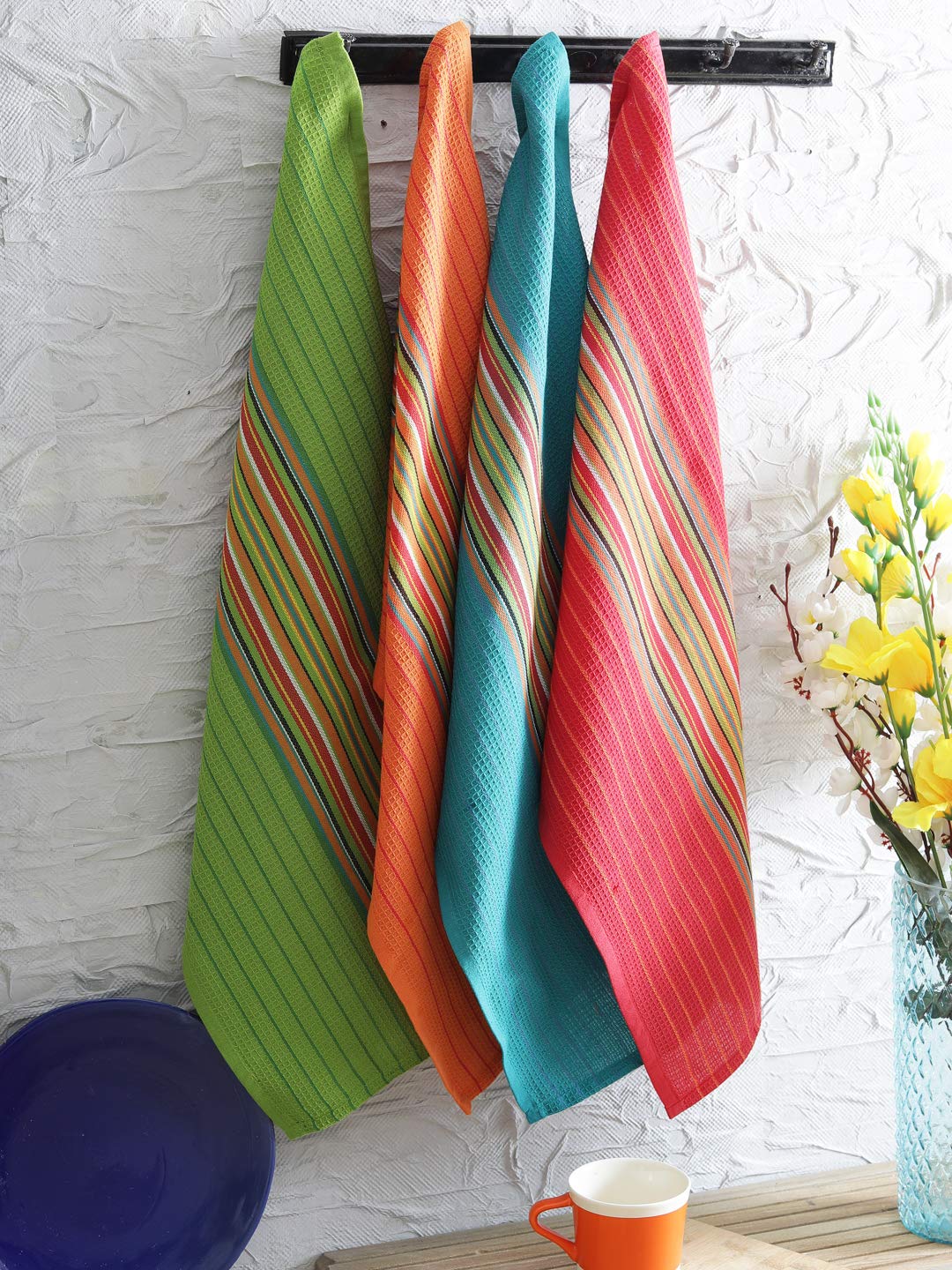 DG Collections towels styled on kitchen countertop adding rustic decor and utility benefit