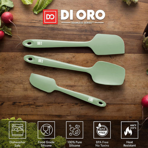 di oro spatulas scraping batter in a mixing bowl to save ingredients