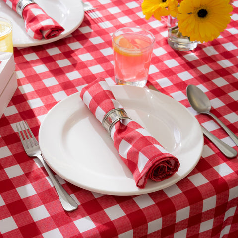 DII tablecloth in use on dining table staged with dinnerware and centerpieces