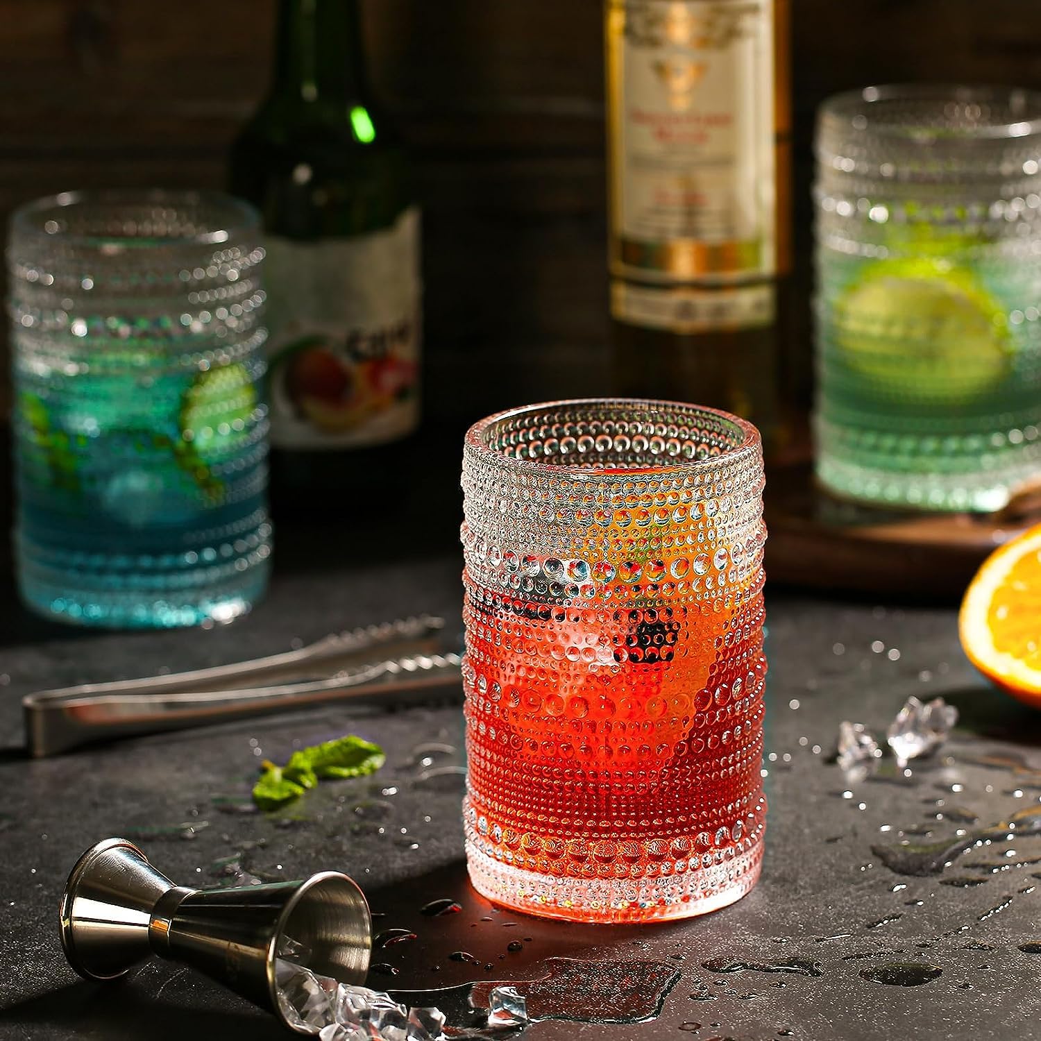 dingerjar glass with cocktail in hand, clear view and elegant serving benefit