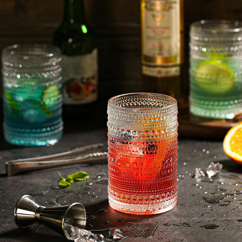 dingerjar glass with cocktail in hand, clear view and elegant serving benefit