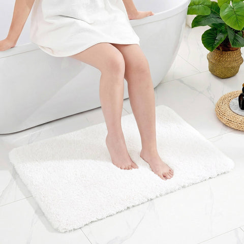 Disolla front view of 24x36 white bath mat showing plush comfort