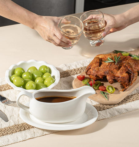 Dizada pouring gravy from boat into plate, controlled pour reduces drips