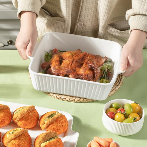 Dizada next to utensils for scale showing compact 10-inch 2.6 qt capacity