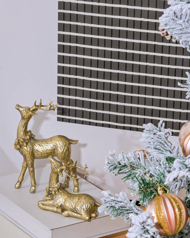 DN DECONATION pine cone wreath detail around reindeer neck showing festive accent