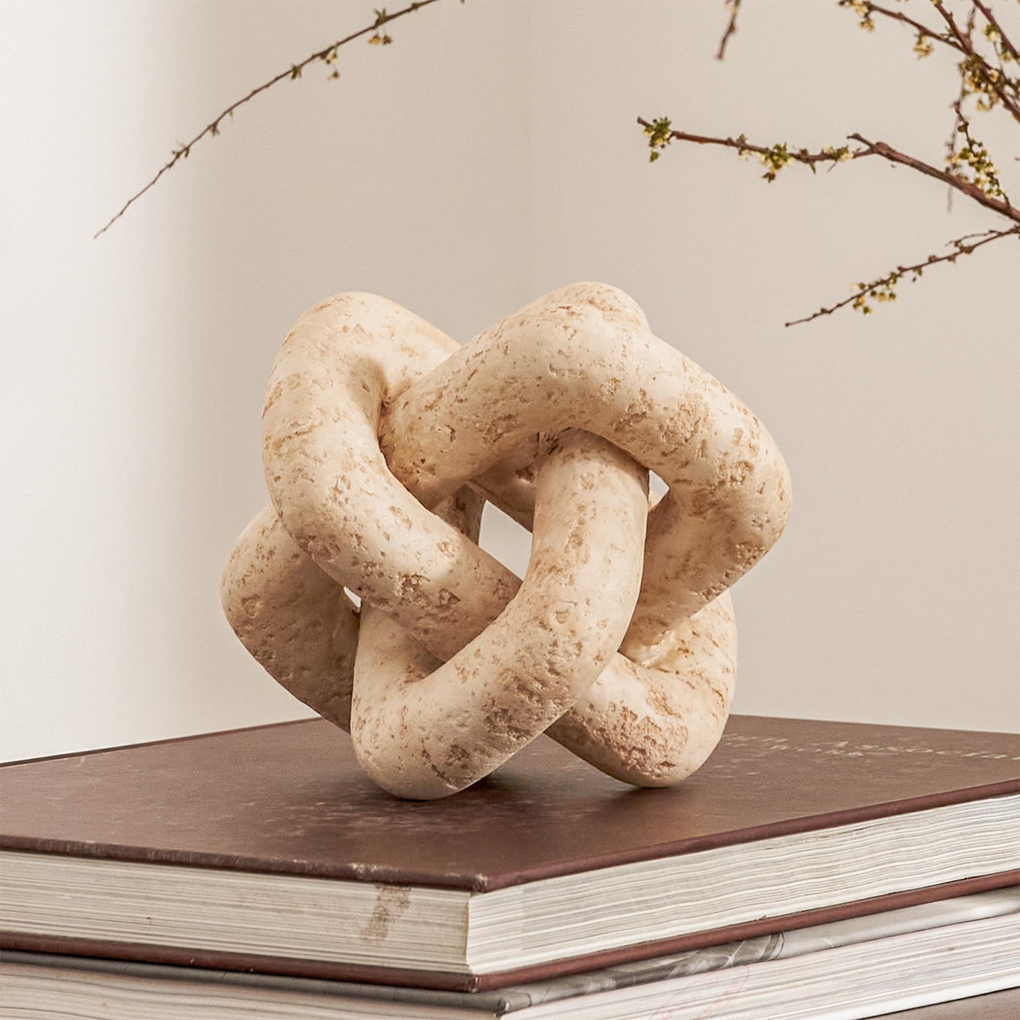 DN DECONATION front view of knot decor showing sculptural curves and neutral tone benefit