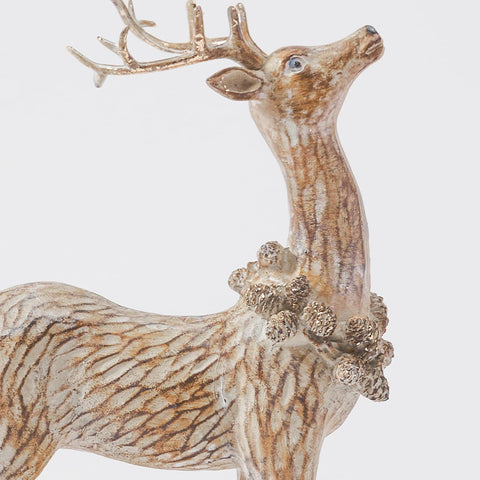 DN DECONATION reindeer displayed on mantel blending with neutral decor