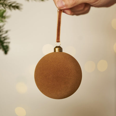 DN DECONATION ornament held next to a hand showing 3.14-inch scale and lightweight safety