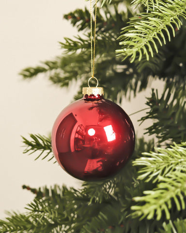 DN DECONATION ornament held in hand showing 3.15-inch scale for planning