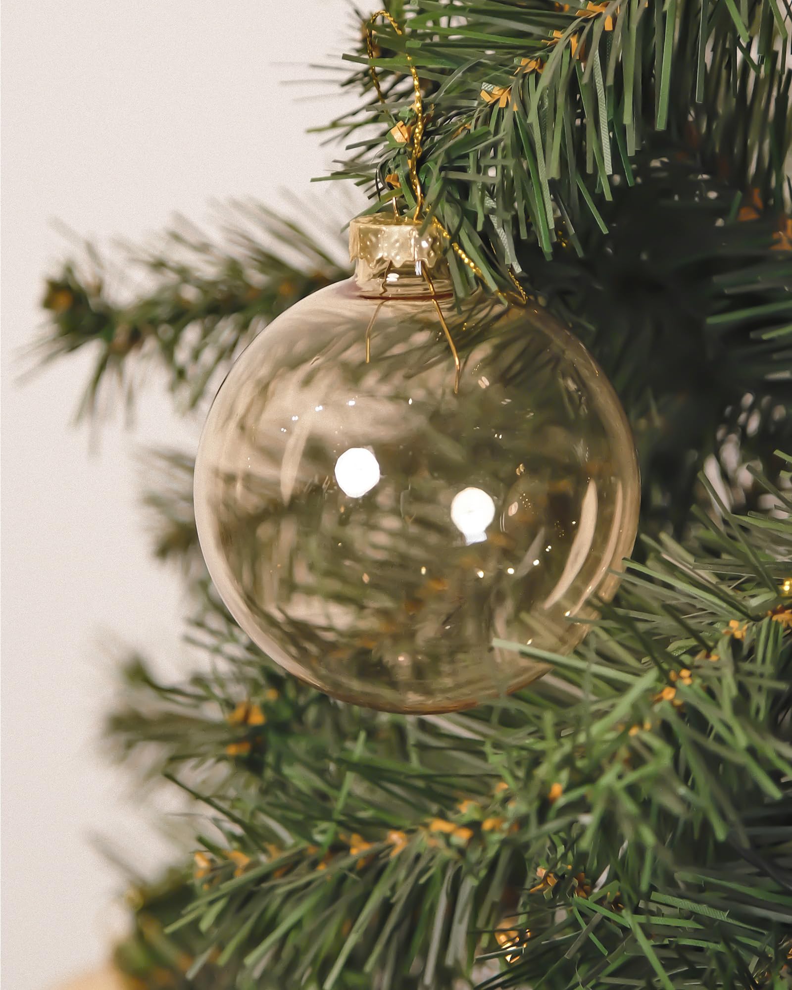 DN DECONATION transparent ornament illuminated by string lights to showcase inner glow
