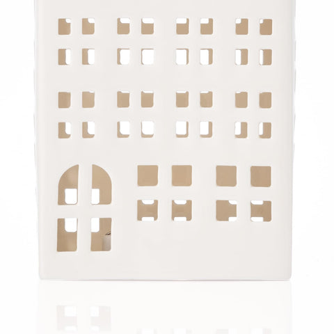 DN DECONATION clustered with other houses to build a layered Christmas village scene