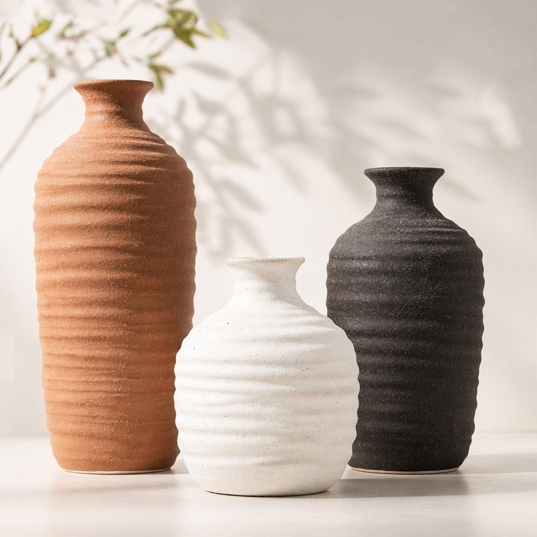 Dobbyby front view of three neutral ceramic vases showing cohesive set for decor