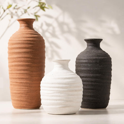 Dobbyby front view of three neutral ceramic vases showing cohesive set for decor
