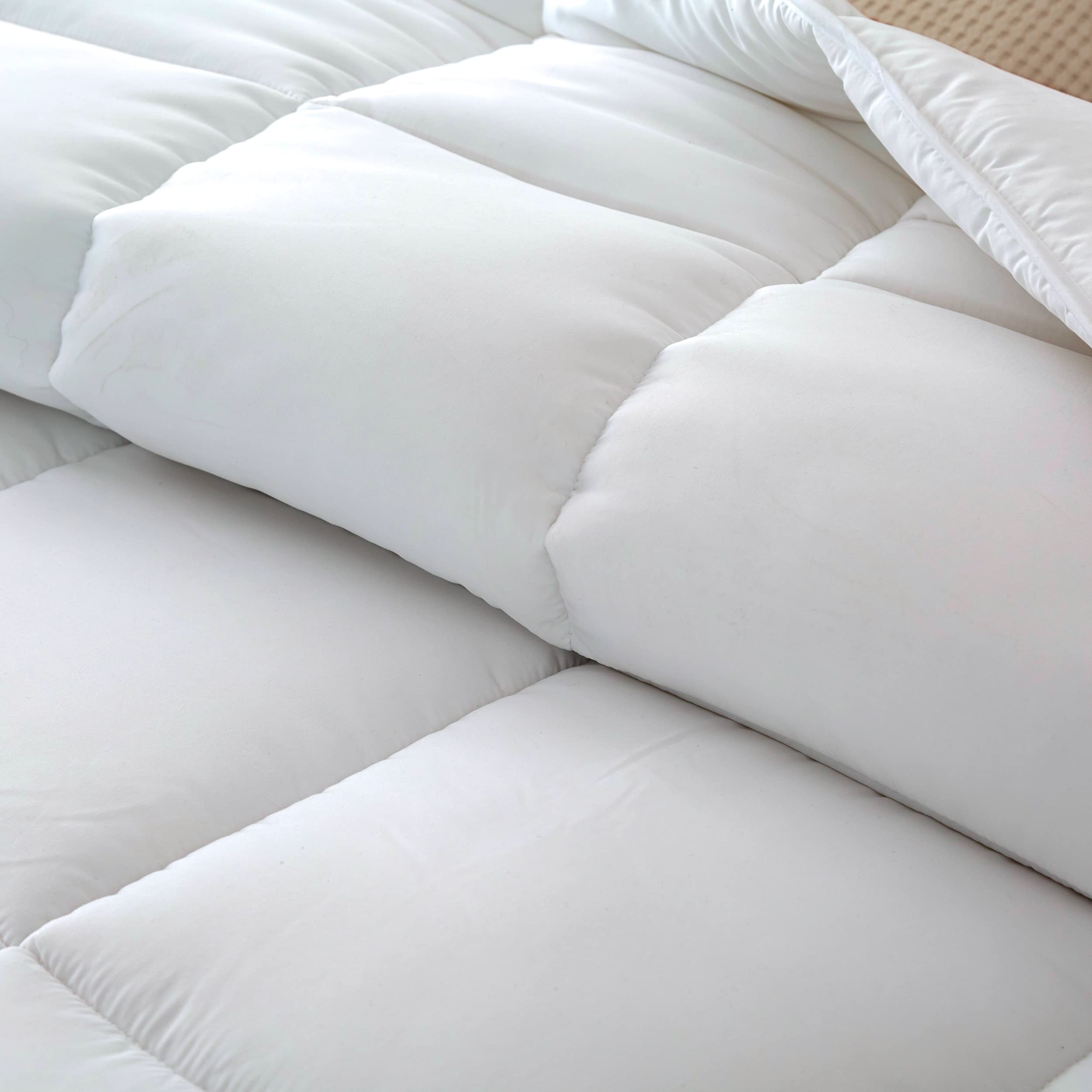 Dorrin Nessin corner tabs visible and ready to secure insert inside a duvet cover