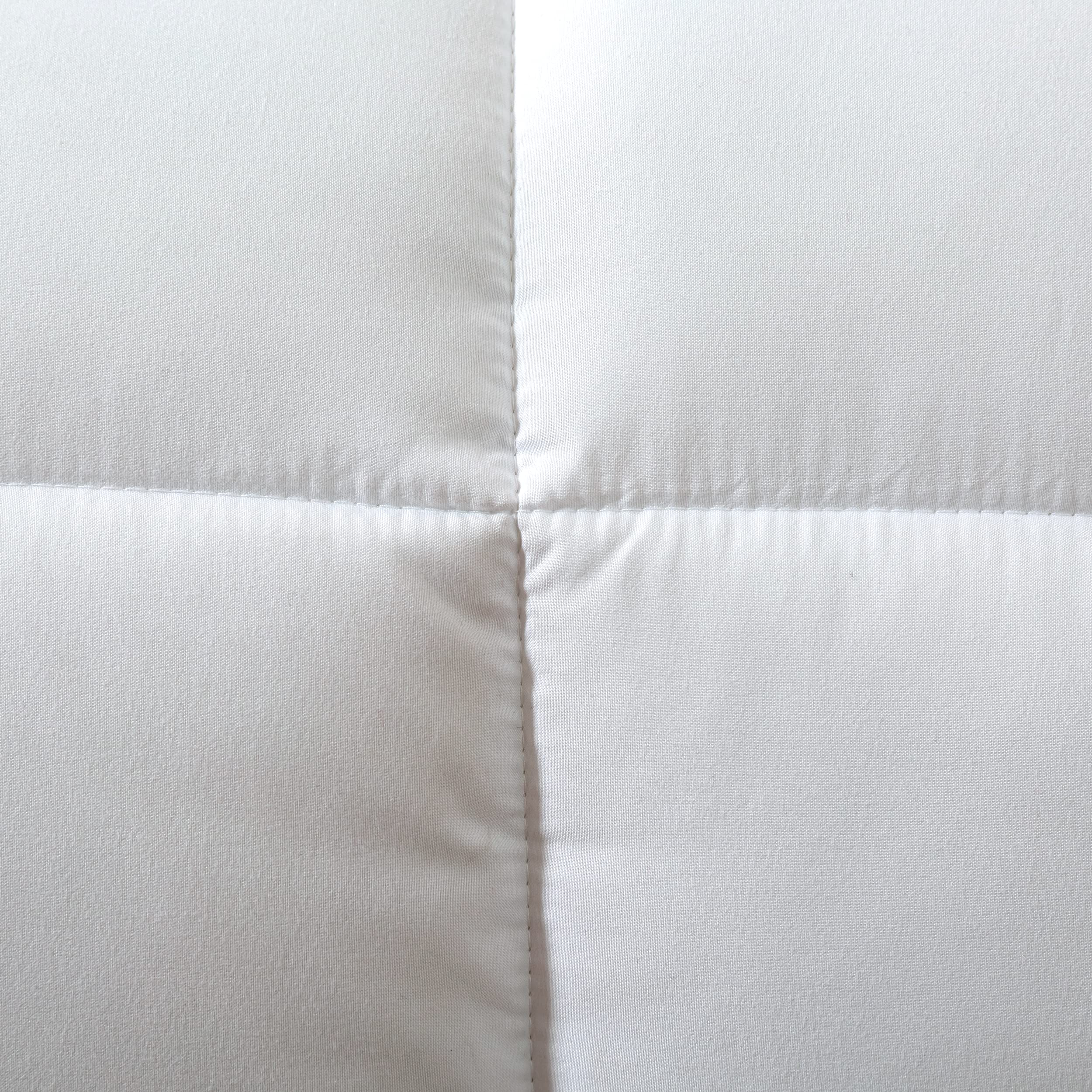 Dorrin Nessin neatly folded comforter ready for storage or travel convenience