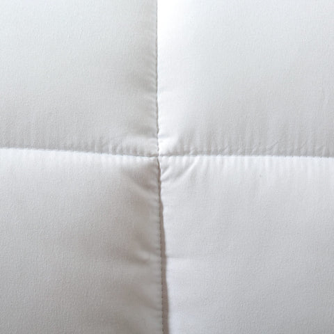 Dorrin Nessin neatly folded comforter ready for storage or travel convenience